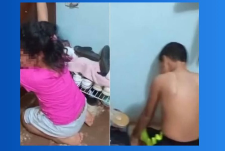 Mujer arrodilló a sus dos hijos encima de unas chapas en el Zulia